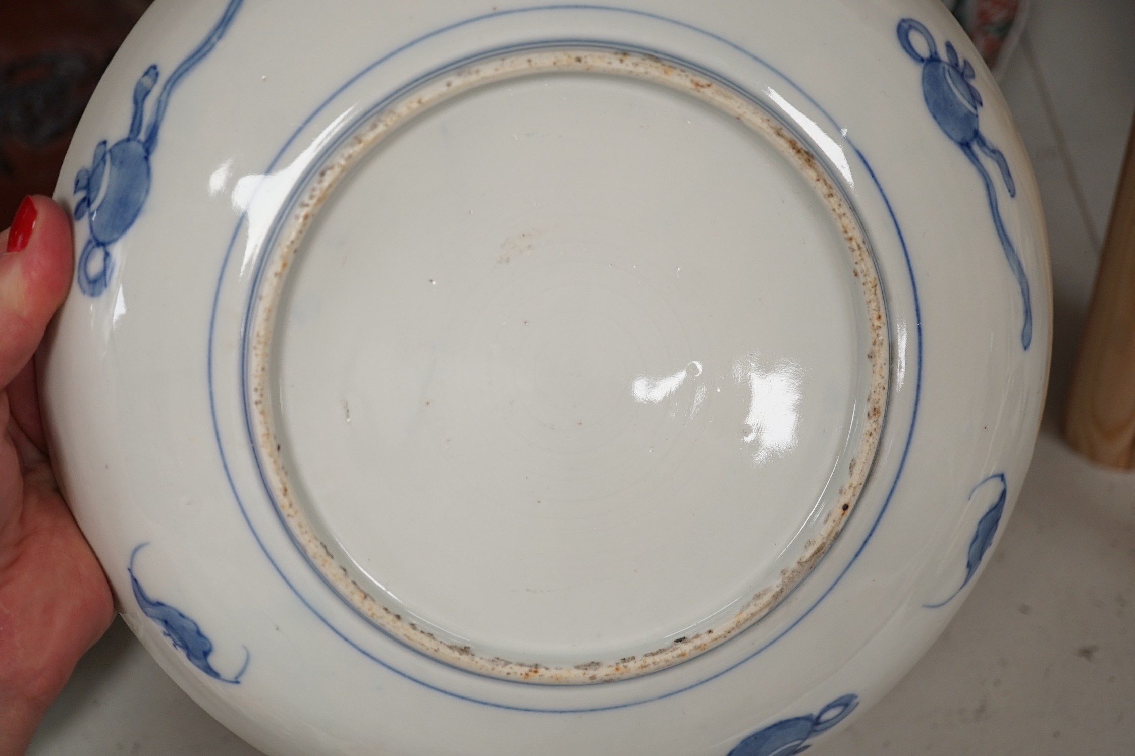 A group of 19th/20th century Japanese porcelain and pottery dishes. Largest 33cm diameter